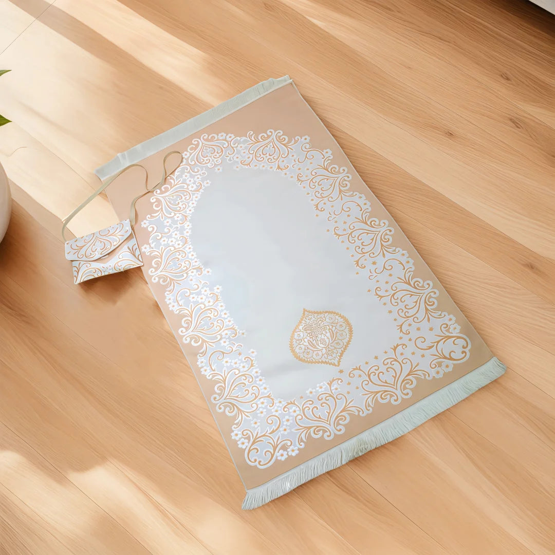 Decorative beige Portable Islamic Prayer Rug with intricate patterns on a wooden surface