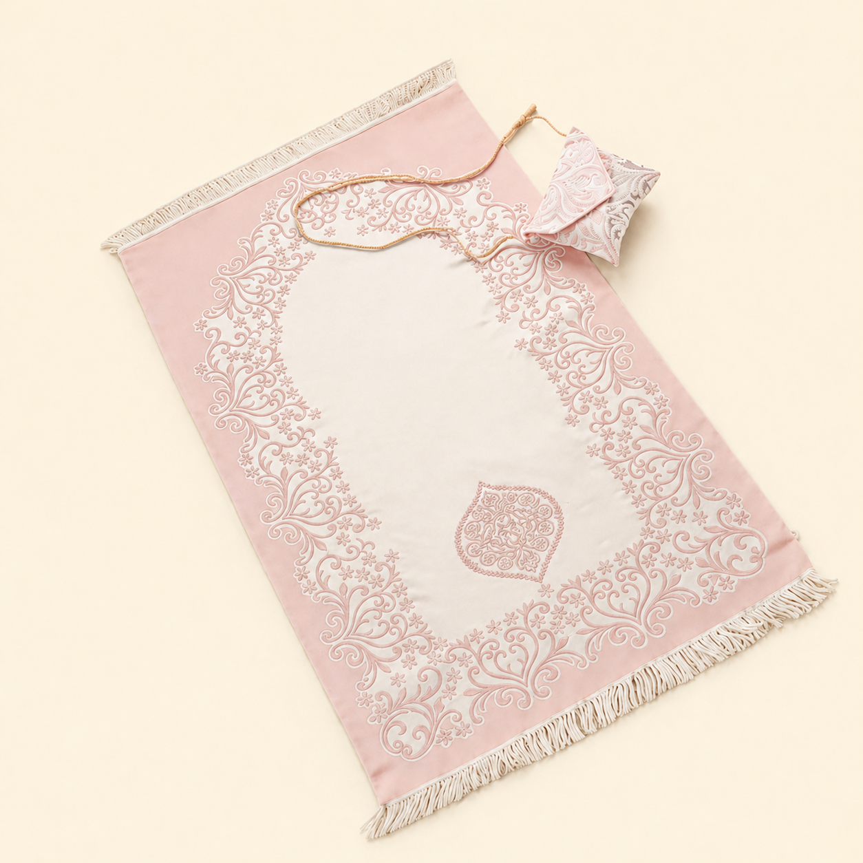 portable Pink Islamic prayer mat with white embroidery on a beige background perfect for Hajj and Umrah pilgrim Travel