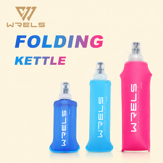 Three WELS folding kettles in blue, pink, and clear on a beige background