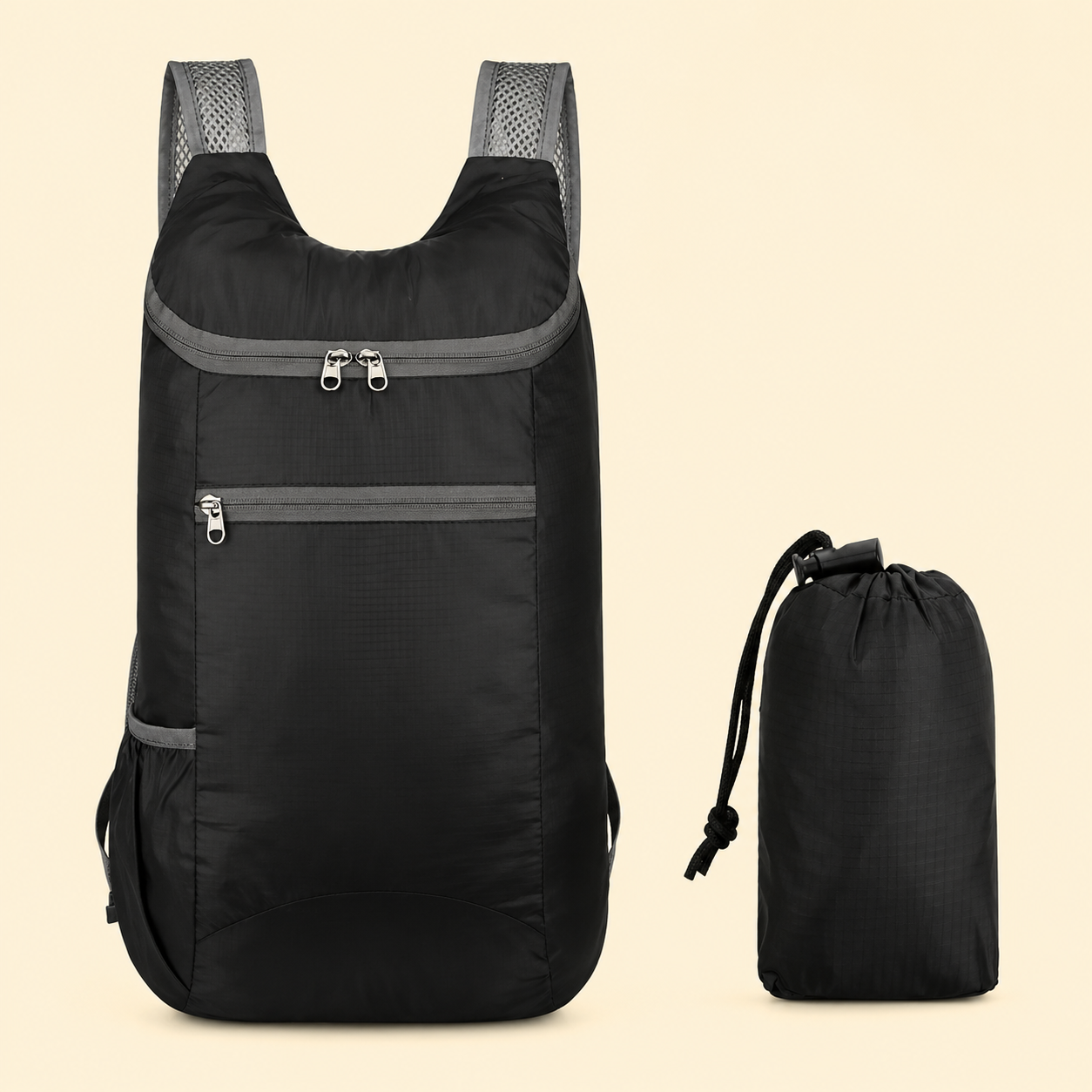 Black backpack with gray accents and a smaller black drawstring bag on a beige background for hajj and umrah pilgrimage