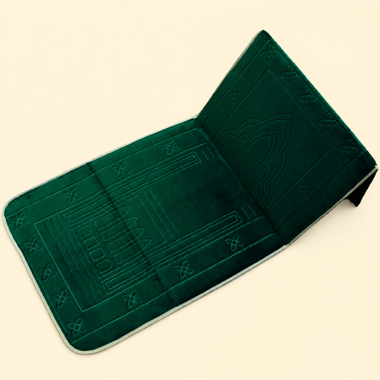 Green textured Islamic Prayer mat with back rest with memory foam on a beige background