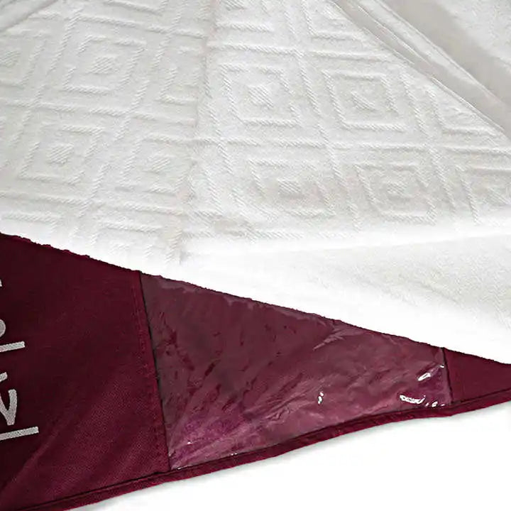 Folded Premium High Quality Ihram with diamond for men for hajj and Umrah pilgrimage that comes in a maroon bag.