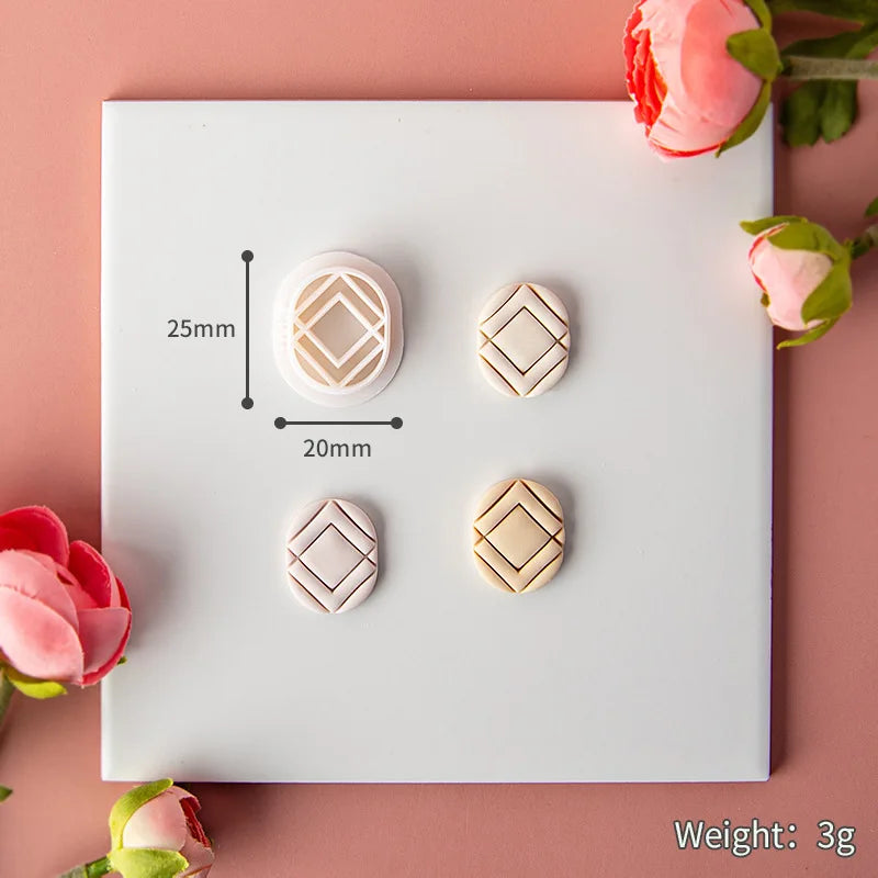 Set of geometric clay mould on a white card with measurements and weight displayed, surrounded by pink flowers.