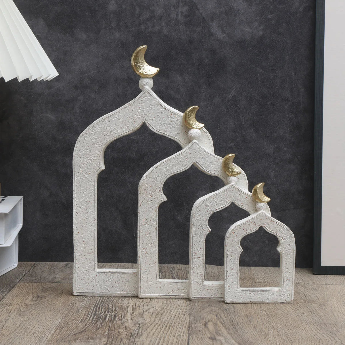 Decorative arches with gold crescent moons on a dark background