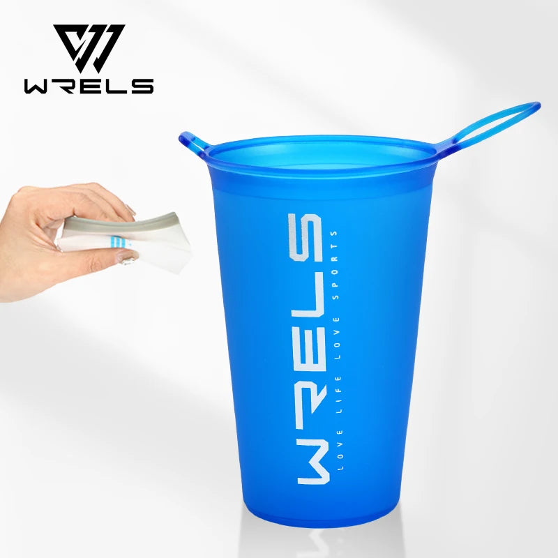 Blue WRELS portable tumbler with a hand holding a straw on a white background