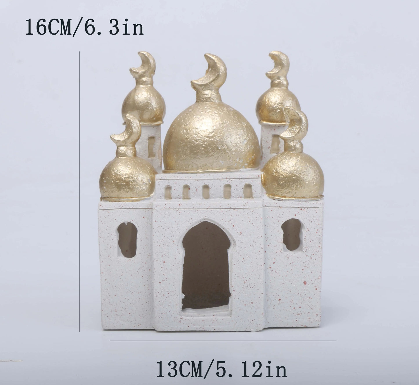 Decorative miniature mosque model with gold domes and white base on a light gray background