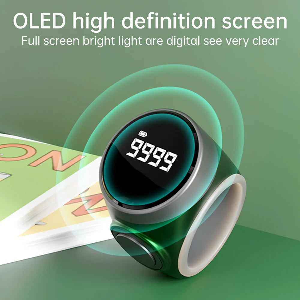 Digital tabih zikr ring device with OLED screen on a green background