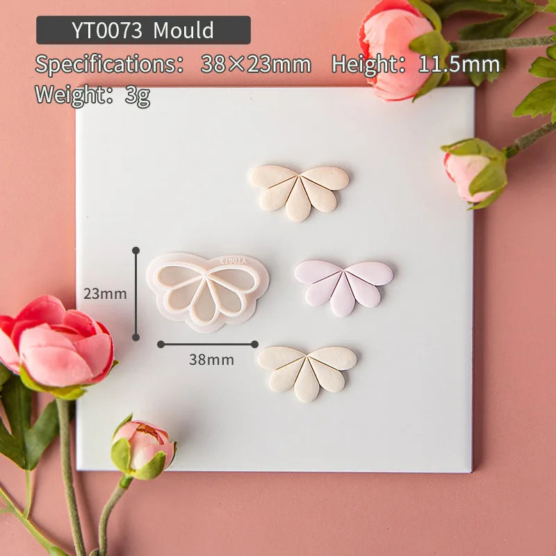 Butterfly-shaped mold on a pink background with floral decorations