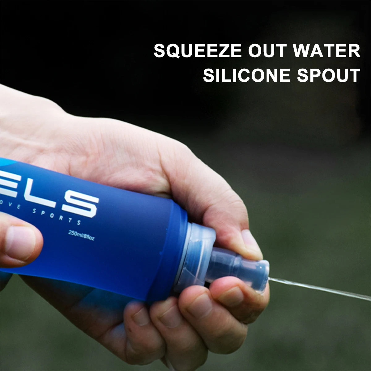 Hand holding a blue water bottle with silicone spout, labeled 'ELS', against a dark background.
