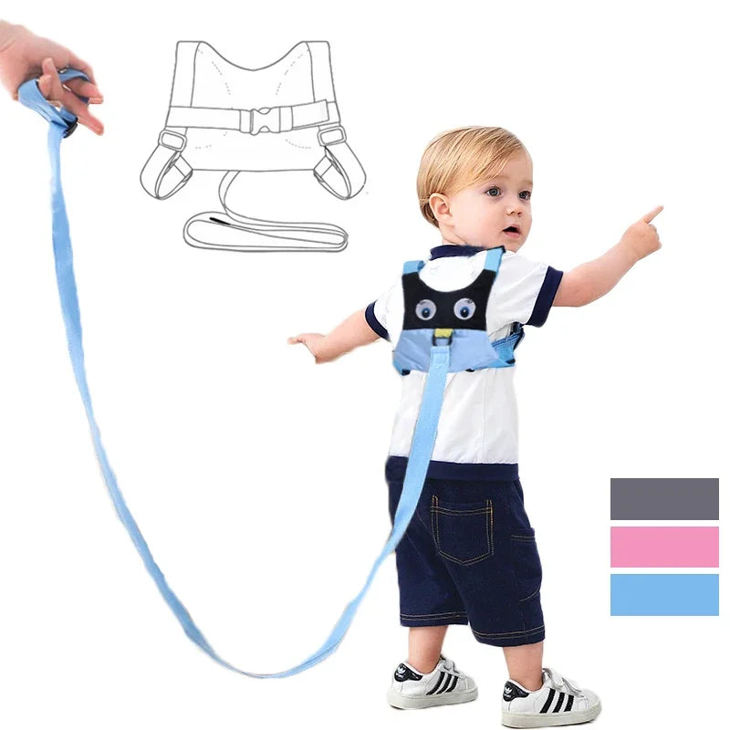 Child wearing a blue safety harness for Hajj and Umrah with a hand holding the other end, on a white background.
