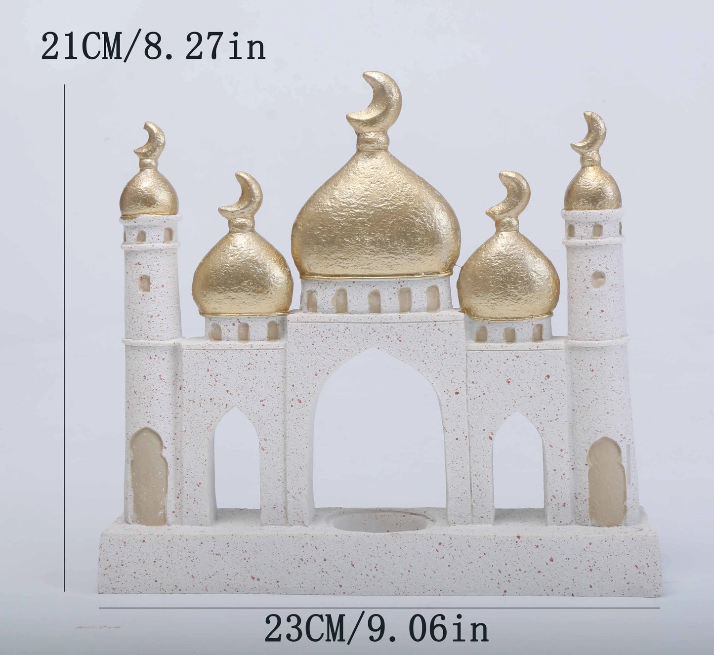 Decorative model of a mosque with gold domes and white base on a light gray background