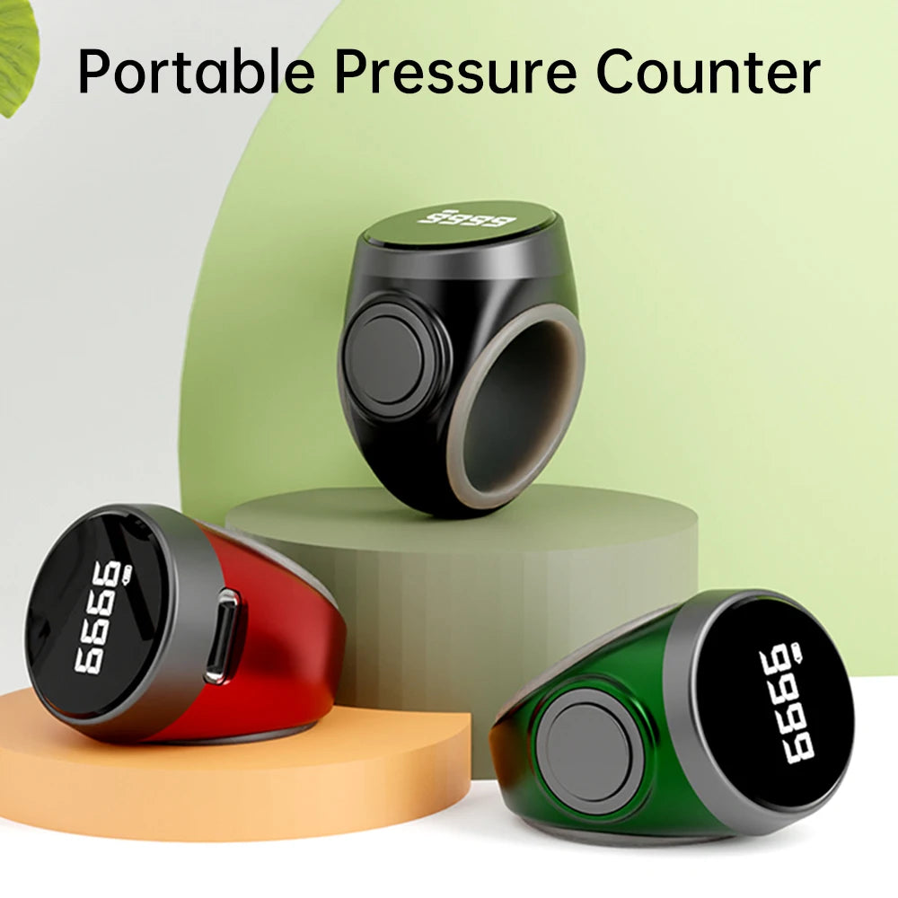 Three portable tasbih zikr ring counters in black, red, and green on a neutral background with 'Portable Pressure Counter' text.