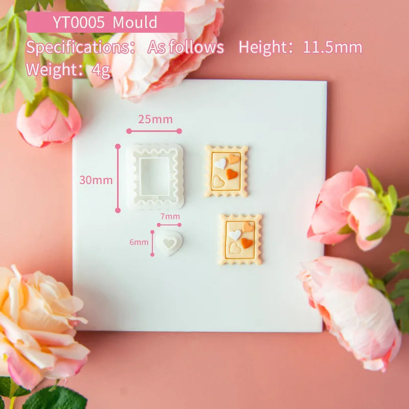 Mould with cookie cutters on a pink background with floral decorations