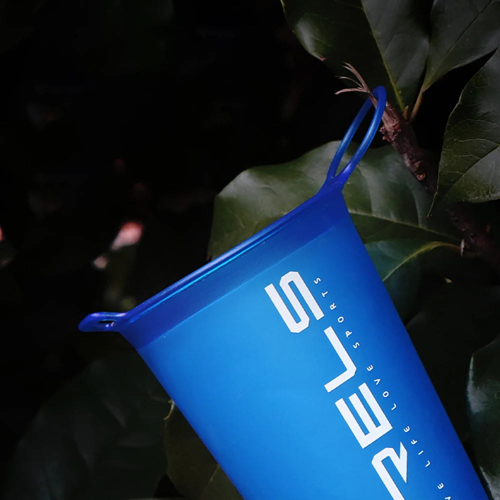 Blue container with a logo on a dark background
