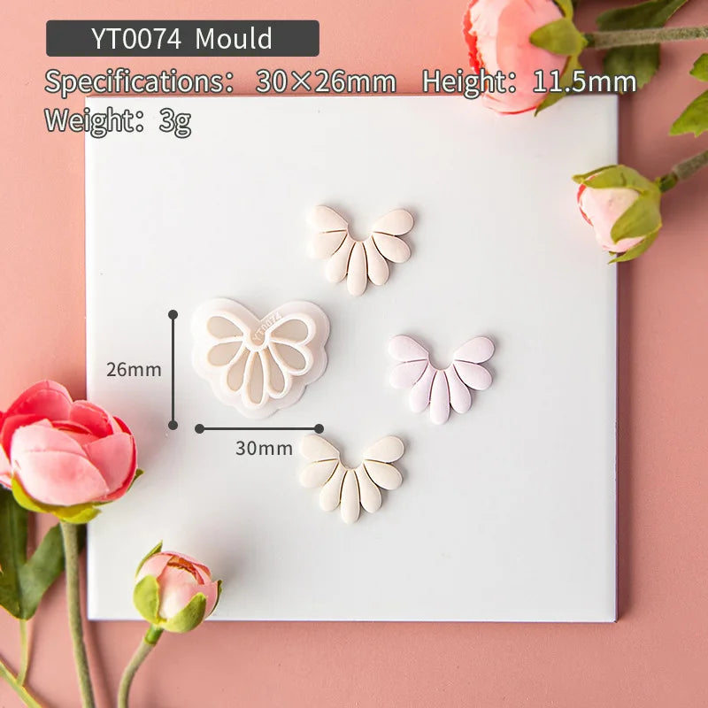 Butterfly-shaped molds on a white card with floral decorations on a pink background