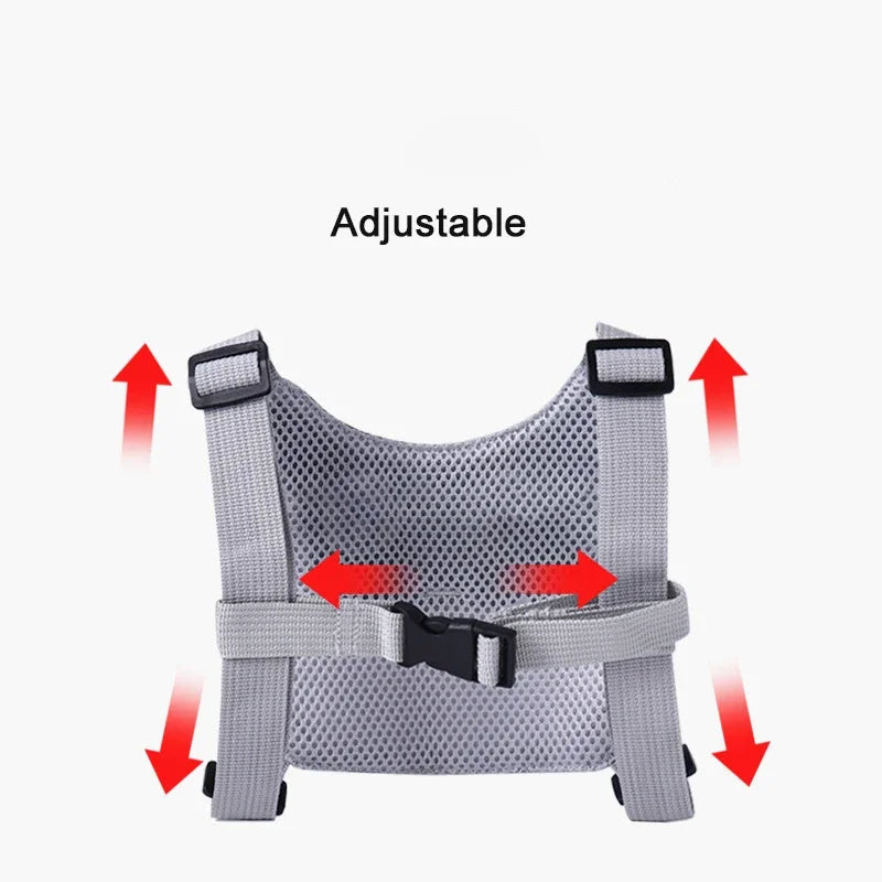 Gray mesh harness with adjustable straps on a white background