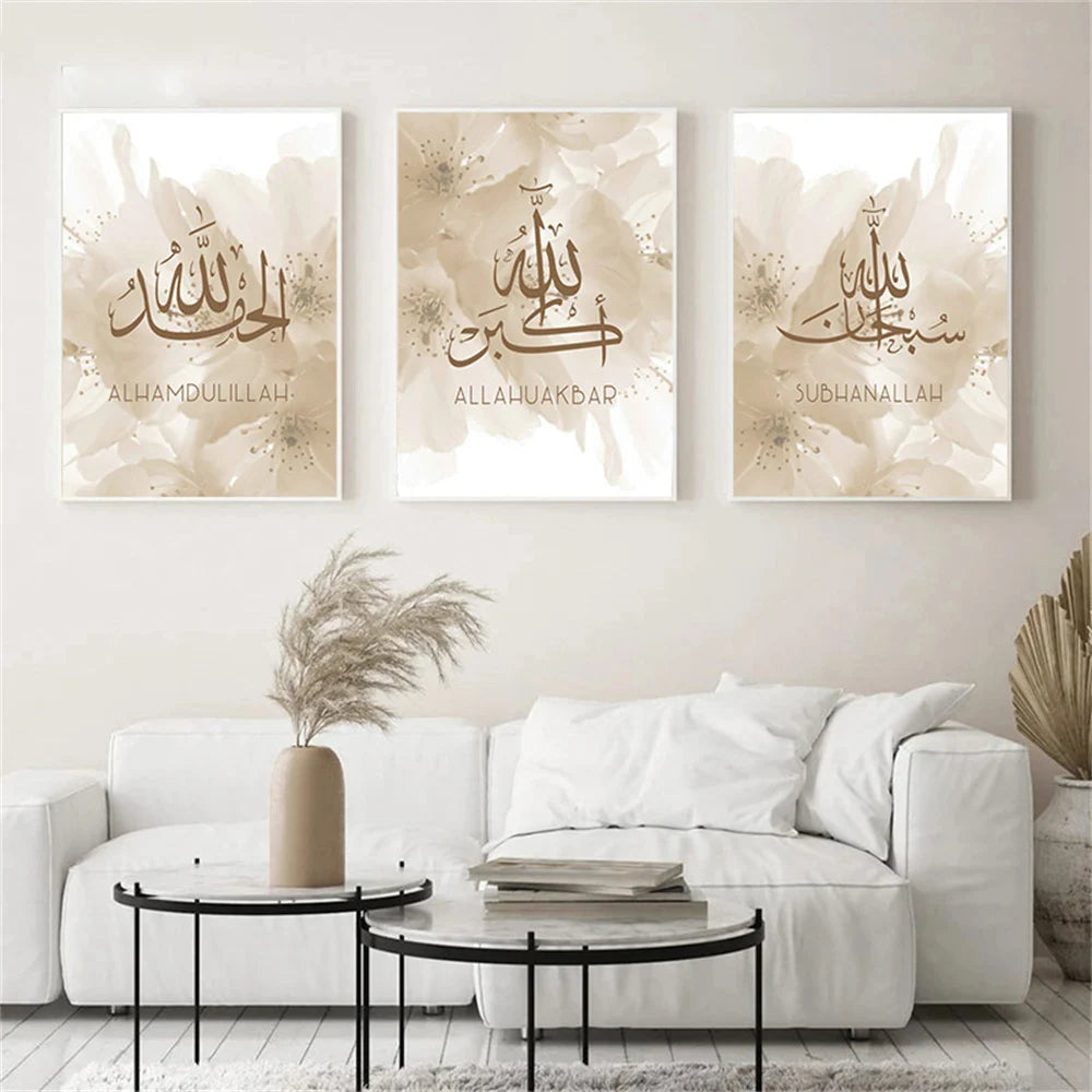 Three framed canvas artworks with Islamic Arabic calligraphy on a wall above a white sofa.