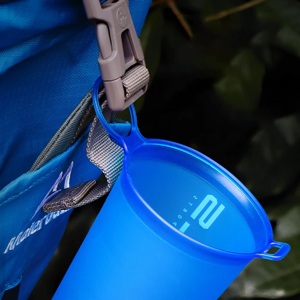 Blue collapsible water bottle with digital measurement display attached to a blue backpack. for hajj and umrah pilgrims