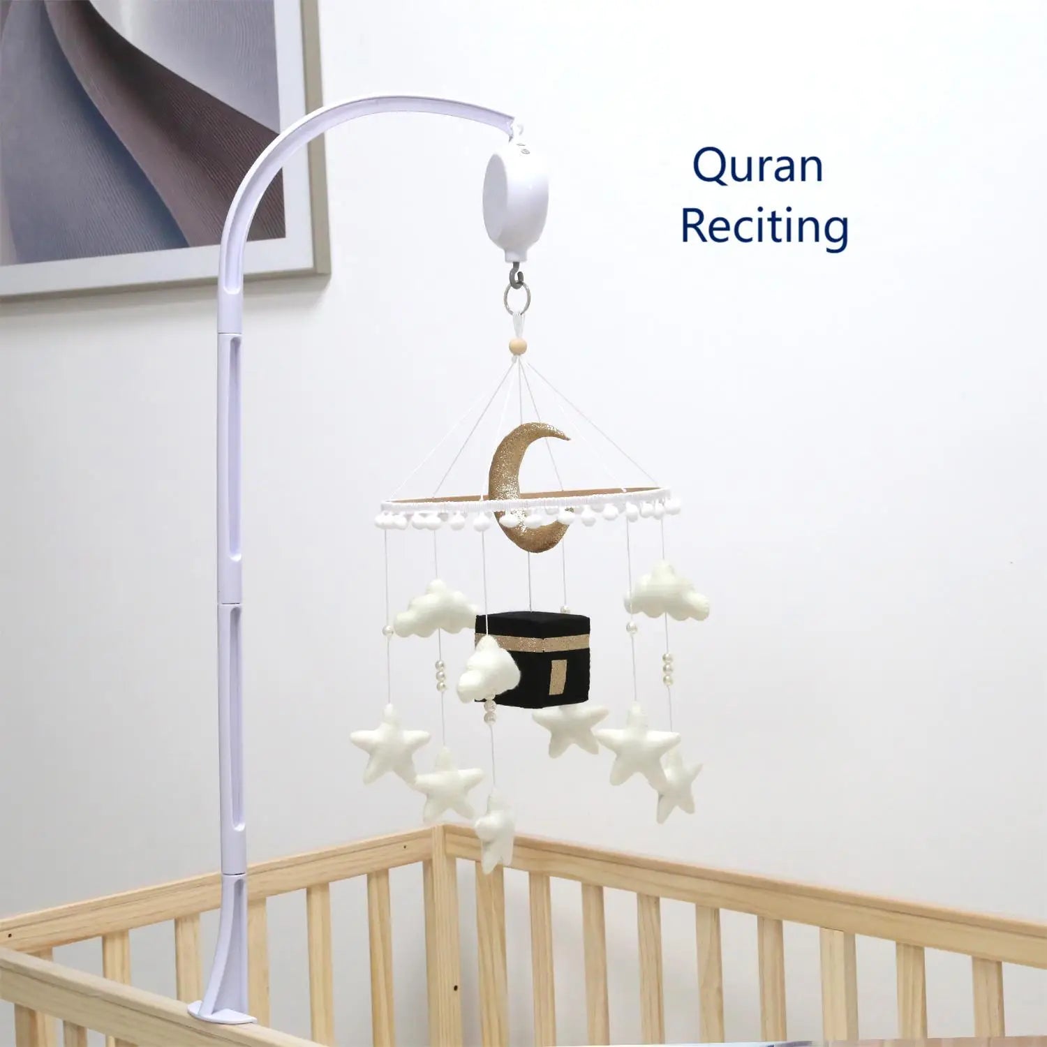 Baby crib mobile with Quran reciting feature in a nursery setting