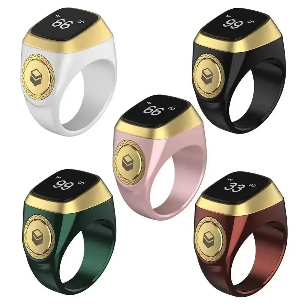 Five smart tasbih rings with gold bands and different colored bodies on a white background for umrah and hajj pilgrims