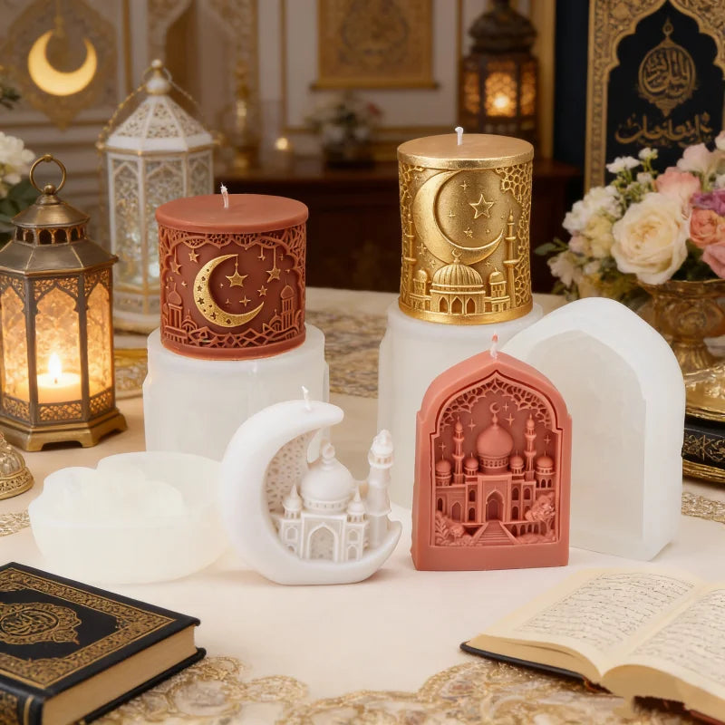 Decorative candles with Islamic design elements on a table with lanterns and flowers.