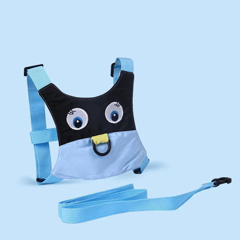 Children's penguin-themed harness and leash for hajj and umrah pilgrimage set on a light blue background