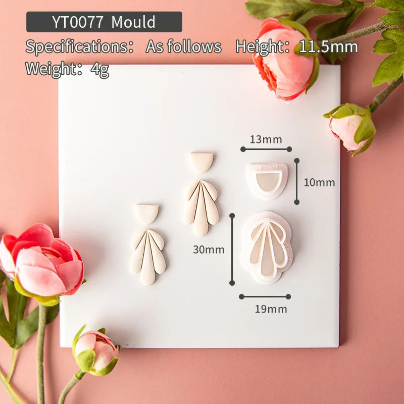 Mould with floral designs and measurements on a pink background with flowers.