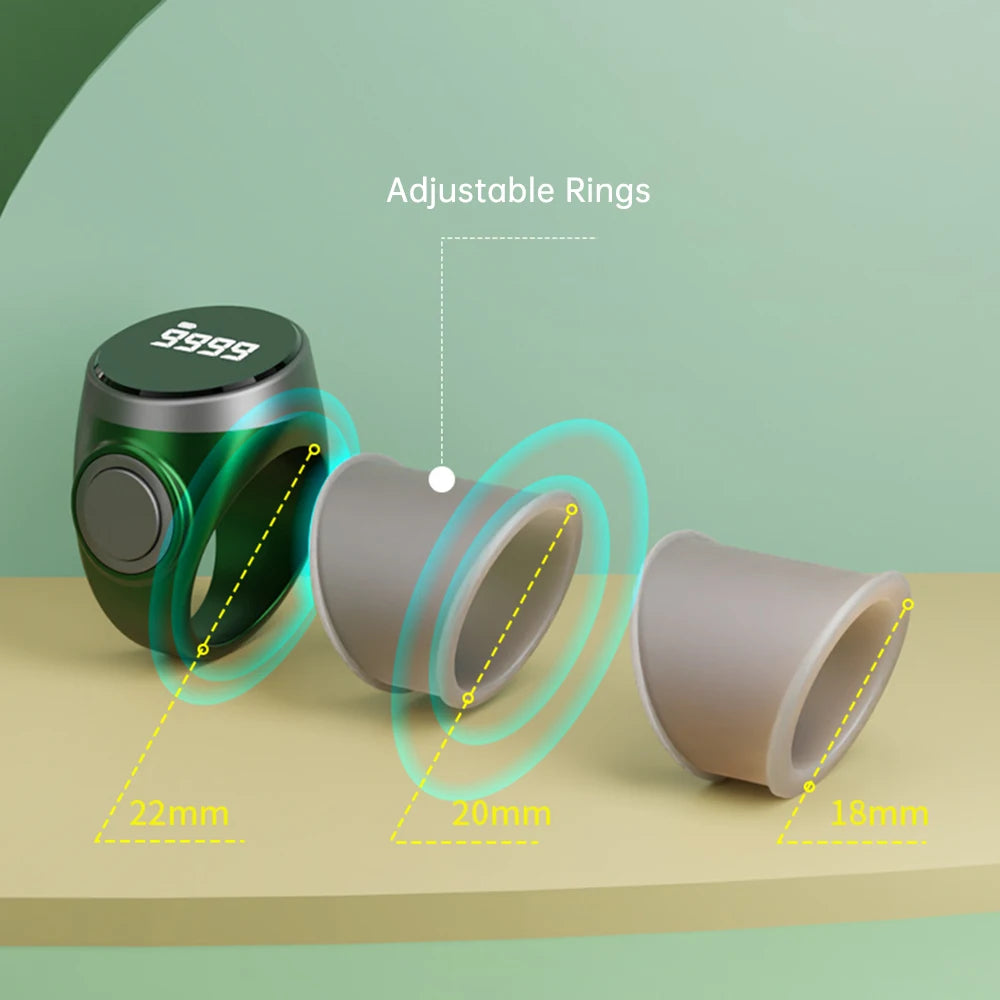 Green and gray tasbih zikr rings with adjustable rings on a green background