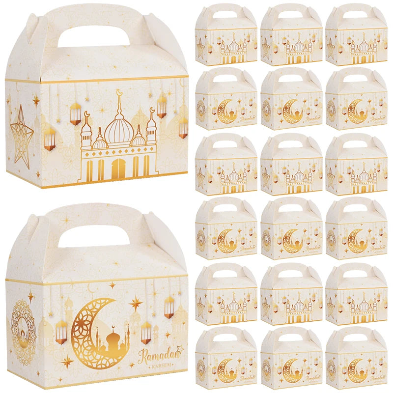 Set of white gift boxes with gold Ramadan designs including crescent moons, stars, and domes.