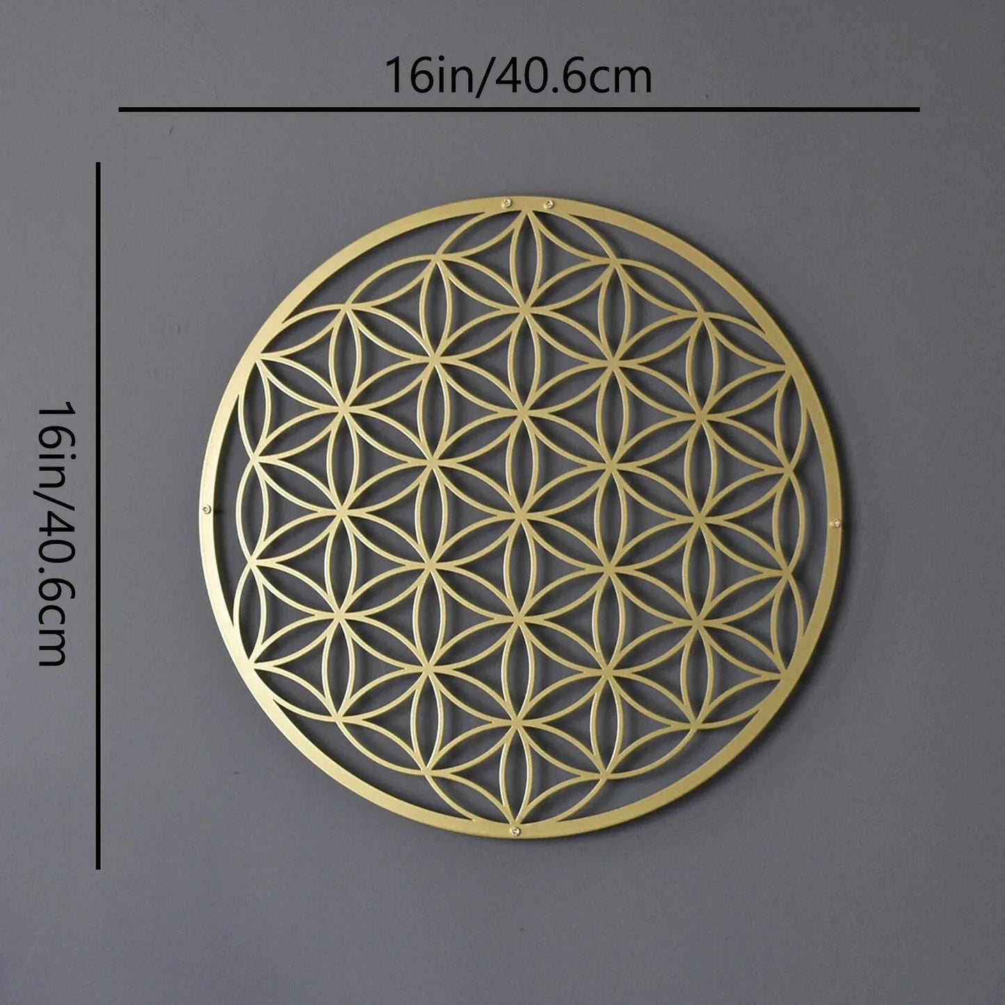 Decorative gold metal wall art with geometric pattern on a gray background