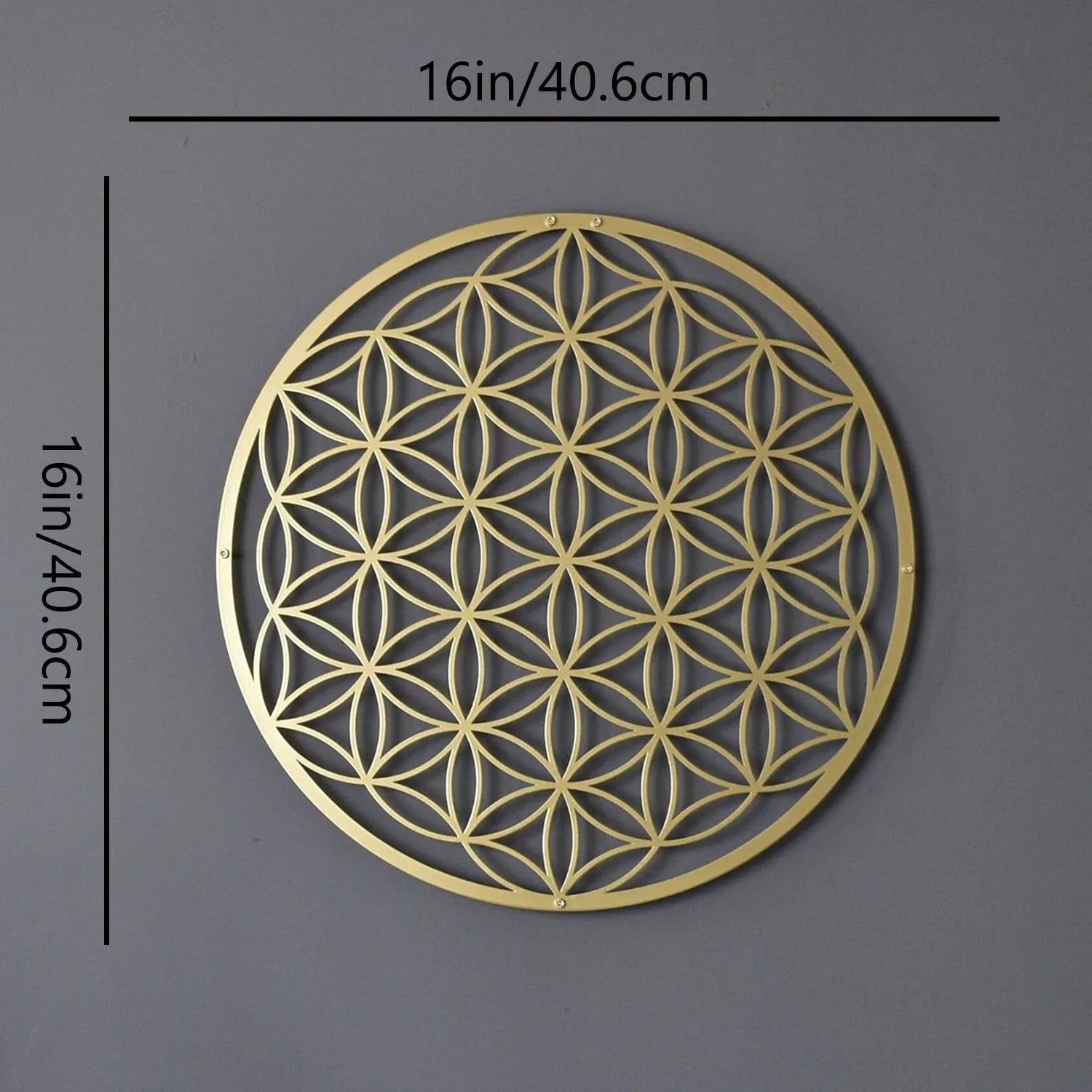 Decorative gold metal wall art with geometric pattern on a gray background